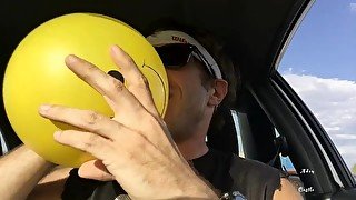 Sweaty Ass Dude In Car Plays With Balloons