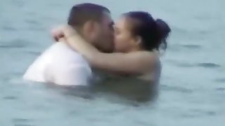 Voyeur tapes a horny couple having sex in the sea