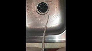 Girl Empties Full Bladder In Kitchen Sink