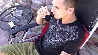 Handsome cutie JD Phoenix smoking during outdoor solo