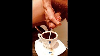 Massive cumshot in a cup of coffee