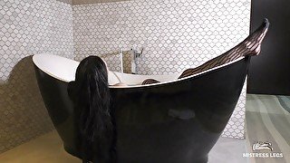 Mistress legs in black fishnets in bath tease and ignore