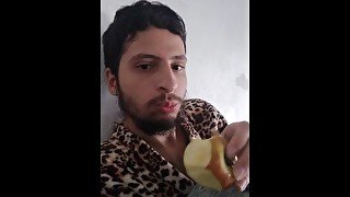 Just a boy resting eating an apple