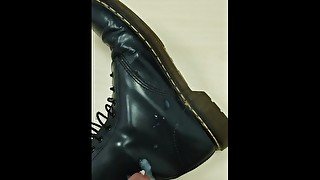 Cumming over blue Doc Martens boots