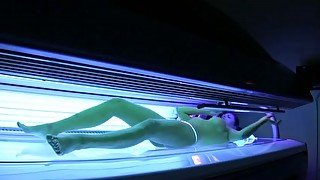 Perfect busty brunette babe in the solarium naked on hidden camera