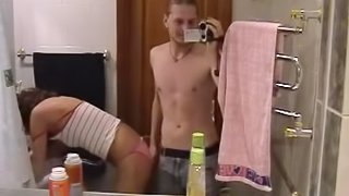 Russian brunette is fucking in the bathroom