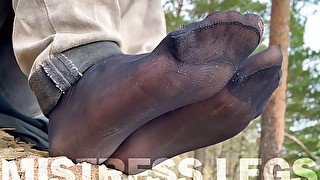 Feet Teasing At The Forest In Torned And Sweaty Black Nylon Socks