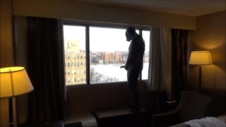 wetsuited masked horny guy comes onto hotel room window