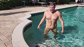 Tanned Hairy Stepdaddy Masturbates And Cums In The Pool