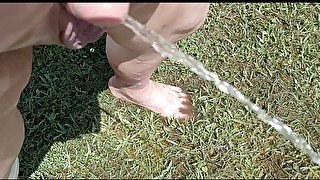 pissing outside naked in rainwater