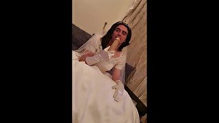 Sissy in my wedding dress. Playing with my sissy clitty. And Cumming. i also suck on a dildo