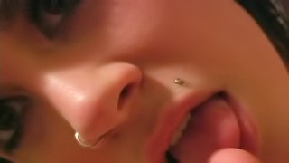 Foot fetish brunette with nose piercing enjoys sucking her toes