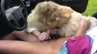 Blonde retro slut in the car giving blowjob to her man