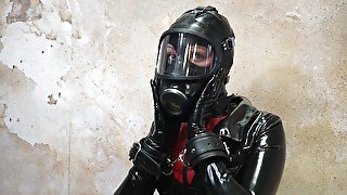 Restrained In Latex And Gasmask