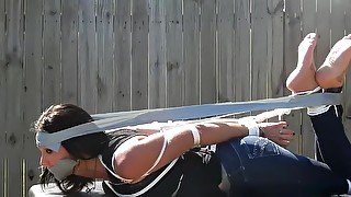 Duct Taped Hogtied gagged outdoor