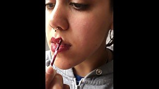 Sexy Argentinian teen puts on makeup while smoking.