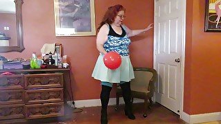 Nurse Vicki plays with a rubber ball in a mini skirt, sexy stockings and high heel mini boots