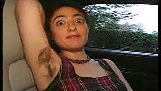 She shows her hairy body in the car