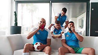 Sporty dudes getting off while watching the game