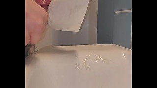 0.25 Slow-motion of public bathroom cum into sink.