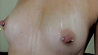 Rubbing Oil on My Small Pierced Tits