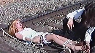 Ticklish Damsel Tickled on Railroad Tracks (nylon bare feet tickling)