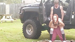 Amateur redhead in 4x4 gets fuck in public