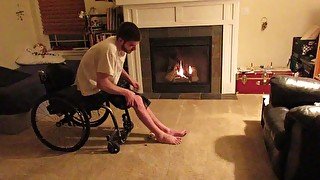 Para in wheelchair stretches legs