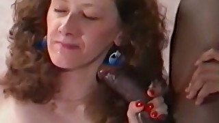 Redhead average milf sucks black dick and shares it with her friend