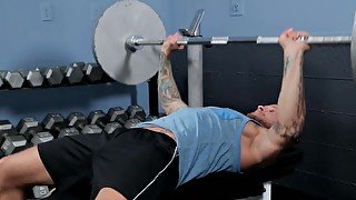 Long haired muscled gay dude gets a cumshot in the gym