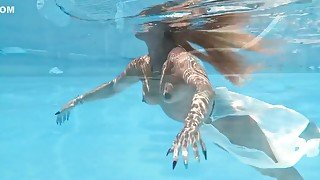 A Woman Floats In A Butterfly-adorned Mesh Dress