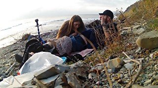 The girl perfectly sucked right on the beach near the sea