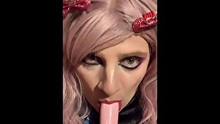 Sissy practices her blowjob technique