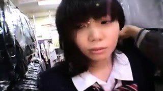 Adorable Asian schoolgirl flashes her sexy legs and her tig