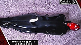 Tiny Slut is Muzzle Gagged Then Locked In A Latex Sack & Made to Cum On A Magic Wand!