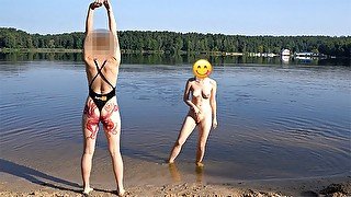 Sexy girl undresses and swims naked in public beach