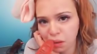 Hot redhead sucks dildo on webcam