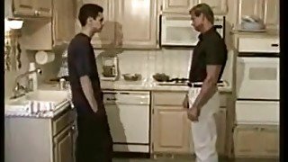 Mature and boy in the kitchen