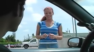 Crazy redhead Brandi Mae gives head in the back of a car