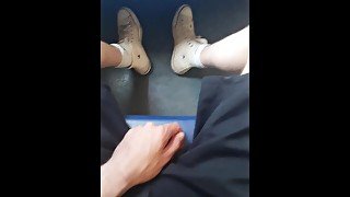 Yong skater show off his sneakers in the train