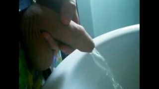 Uncut cock gets semi while pissing!