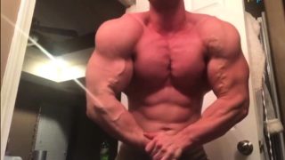 muscle guy showing off his super built