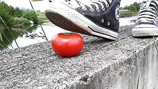 Tomato crushed under All Star Converse sneakers