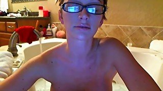 Camgirl hops in the bathtub and washes tits