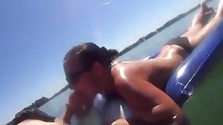 Inner tube blowjob on the lake