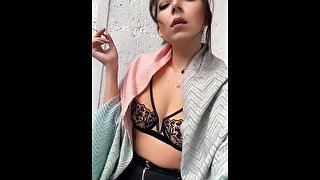 Sexy milf is smoking in lingerie