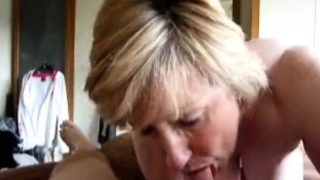 Mature wife blowing her lover's hard cock