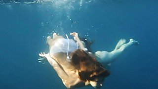 Nastya and Masha are swimming nude in the sea