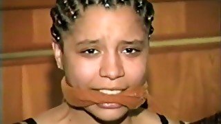 Ebony Girl Mouth Stuffed and Wrap Gagged