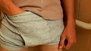 Sweet looking Kelly masturbates after pissing all over himself